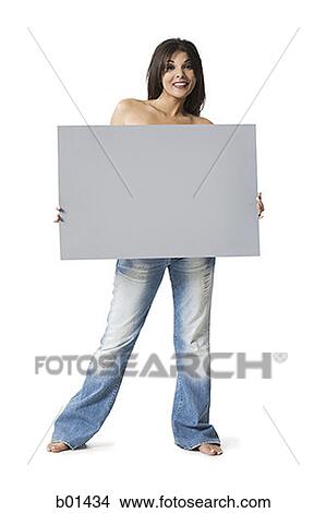 Picture - Portrait of a young woman holding a blank sign. Fotosearch