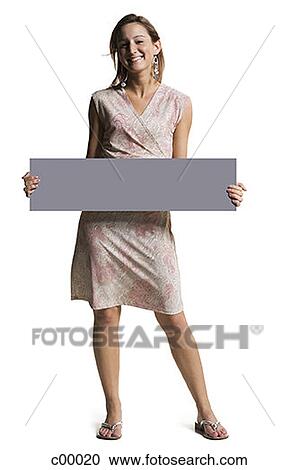 Stock Image - Portrait of a young woman holding a blank sign. Fotosearch