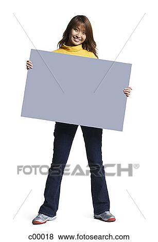 Stock Photo - Portrait of a young woman holding a blank sign. Fotosearch