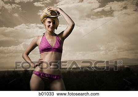Portrait of a young woman in a bikini View Large Photo Image Stock Image - Portrait of a young woman in a bikini. Fotosearch