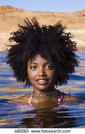 Portrait of a young woman in a lake View Large Photo Image Stock Image - Portrait of a young woman in a lake. Fotosearch