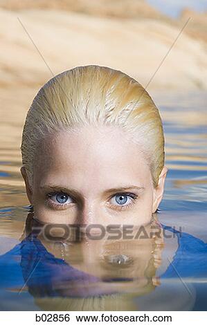 Portrait of a young woman in a lake View Large Photo Image Stock Photograph - Portrait of a young woman in a lake. Fotosearch