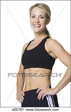 Portrait of a young woman in sports clothing View Large Photo Image Stock Photo - Portrait of a young woman in sports clothing. Fotosearch