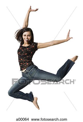 Portrait of a young woman jumping View Large Photo Image Picture - Portrait of a young woman jumping. Fotosearch