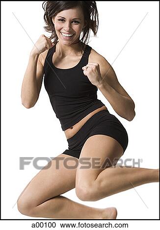Portrait of a young woman jumping View Large Photo Image Stock Image - Portrait of a young woman jumping. Fotosearch