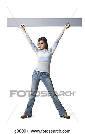 Stock Photo - Portrait of a young woman lifting up a blank sign. Fotosearch