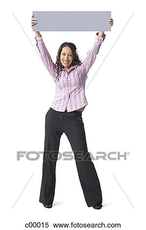 Portrait of a young woman lifting up a blank sign View Large Photo Image Stock Photography - Portrait of a young woman lifting up a blank sign. Fotosearch