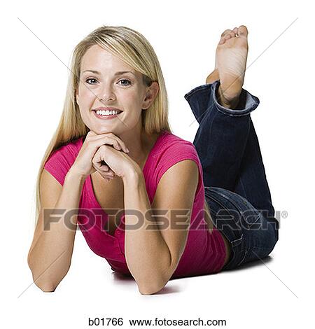 Portrait of a young woman lying down View Large Photo Image Stock Photograph - Portrait of a young woman lying down. Fotosearch