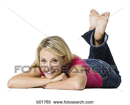 Portrait of a young woman lying down View Large Photo Image Stock Photography - Portrait of a young woman lying down. Fotosearch
