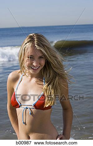 Portrait of a young woman on the beach View Large Photo Image Stock Photo - Portrait of a young woman on the beach. Fotosearch