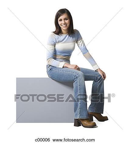 Portrait of a young woman sitting on a blank sign and smiling View Large Photo Image Stock Photograph - Portrait of a young woman sitting on a blank sign and smiling. Fotosearch