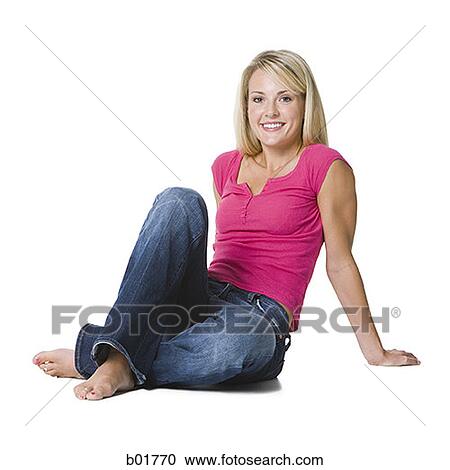 Portrait of a young woman sitting on the floor View Large Photo Image Stock Image - Portrait of a young woman sitting on the floor. Fotosearch