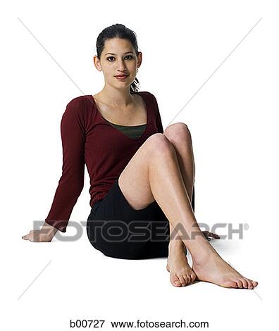 Portrait of a young woman sitting View Large Photo Image Stock Photo - Portrait of a young woman sitting. Fotosearch