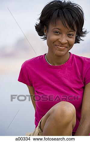 Picture - Portrait of a young woman smiling. Fotosearch