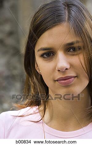 Portrait of a young woman smiling View Large Photo Image Picture - Portrait of a young woman smiling. Fotosearch