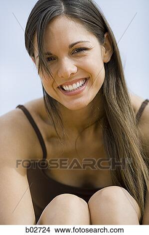 Portrait of a young woman smiling View Large Photo Image Picture - Portrait of a young woman smiling. Fotosearch