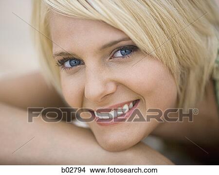 Portrait of a young woman smiling View Large Photo Image Picture - Portrait of a young woman smiling. Fotosearch