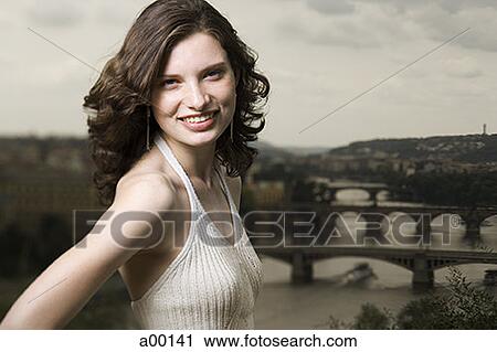Stock Image - Portrait of a young woman smiling. Fotosearch