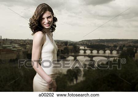 Portrait of a young woman smiling View Large Photo Image Stock Image - Portrait of a young woman smiling. Fotosearch