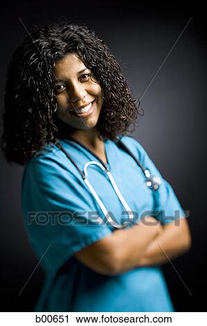 Portrait of a young woman smiling View Large Photo Image Stock Image - Portrait of a young woman smiling. Fotosearch