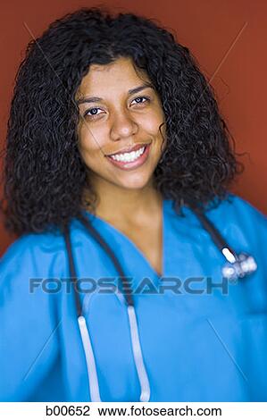 Portrait of a young woman smiling View Large Photo Image Stock Image - Portrait of a young woman smiling. Fotosearch
