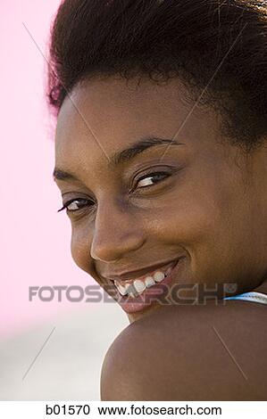 Portrait of a young woman smiling View Large Photo Image Stock Image - Portrait of a young woman smiling. Fotosearch