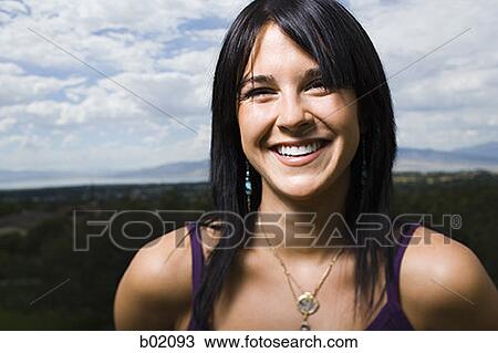 Portrait of a young woman smiling View Large Photo Image Stock Image - Portrait of a young woman smiling. Fotosearch