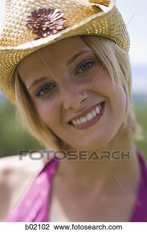 Portrait of a young woman smiling View Large Photo Image Stock Image - Portrait of a young woman smiling. Fotosearch