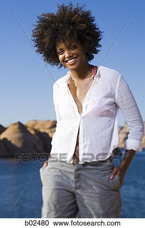 Portrait of a young woman smiling View Large Photo Image Stock Image - Portrait of a young woman smiling. Fotosearch