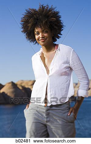 Portrait of a young woman smiling View Large Photo Image Stock Image - Portrait of a young woman smiling. Fotosearch