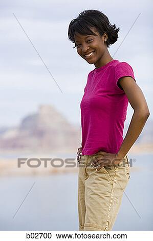 Portrait of a young woman smiling View Large Photo Image Stock Image - Portrait of a young woman smiling. Fotosearch