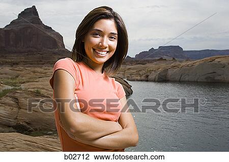 Portrait of a young woman smiling View Large Photo Image Stock Image - Portrait of a young woman smiling. Fotosearch