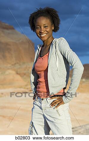Portrait of a young woman smiling View Large Photo Image Stock Image - Portrait of a young woman smiling. Fotosearch