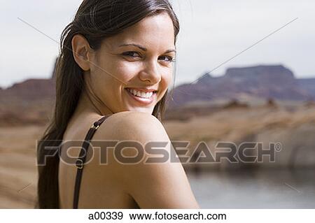 Portrait of a young woman smiling View Large Photo Image Stock Photo - Portrait of a young woman smiling. Fotosearch