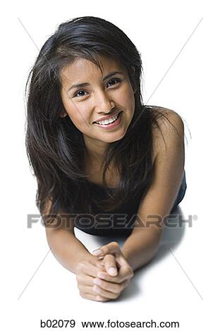 Portrait of a young woman smiling View Large Photo Image Stock Photo - Portrait of a young woman smiling. Fotosearch