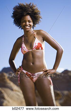 Portrait of a young woman smiling View Large Photo Image Stock Photo - Portrait of a young woman smiling. Fotosearch