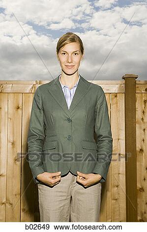 Portrait of a young woman smiling View Large Photo Image Stock Photo - Portrait of a young woman smiling. Fotosearch