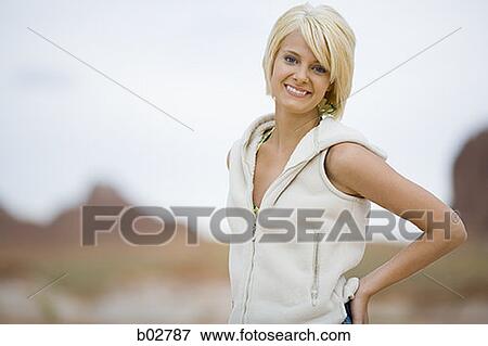 Portrait of a young woman smiling View Large Photo Image Stock Photo - Portrait of a young woman smiling. Fotosearch