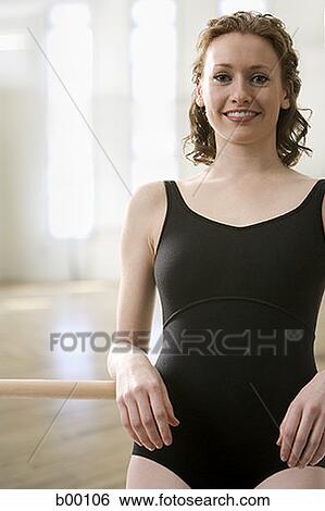 Portrait of a young woman smiling View Large Photo Image Stock Photograph - Portrait of a young woman smiling. Fotosearch