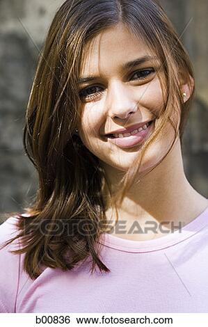 Portrait of a young woman smiling View Large Photo Image Stock Photograph - Portrait of a young woman smiling. Fotosearch