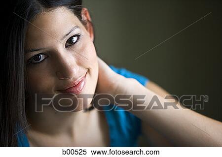 Portrait of a young woman smiling View Large Photo Image Stock Photography - Portrait of a young woman smiling. Fotosearch