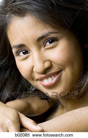 Portrait of a young woman smiling View Large Photo Image Stock Photography - Portrait of a young woman smiling. Fotosearch