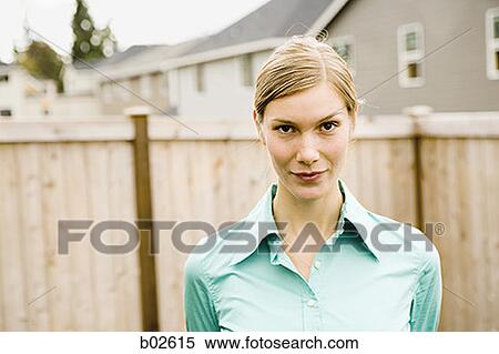 Portrait of a young woman standing View Large Photo Image Stock Photography - Portrait of a young woman standing. Fotosearch