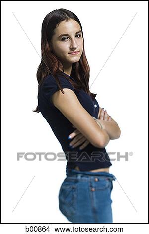 Picture - Portrait of a young woman standing with her arms crossed. Fotosearch