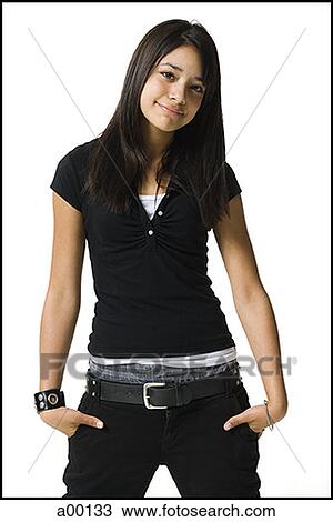 Portrait of a young woman standing with her hands in her pockets View Large Photo Image Stock Image - Portrait of a young woman standing with her hands in her pockets. Fotosearch