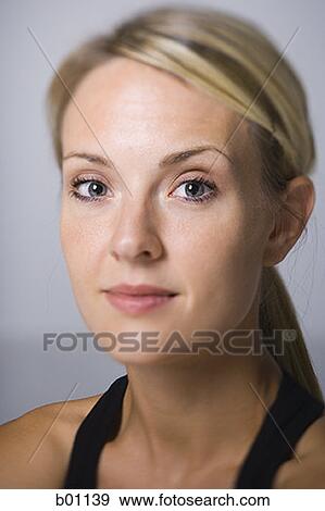 Portrait of a young woman View Large Photo Image Stock Photo - Portrait of a young woman. Fotosearch