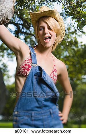 Portrait of a young woman winking View Large Photo Image Stock Image - Portrait of a young woman winking. Fotosearch