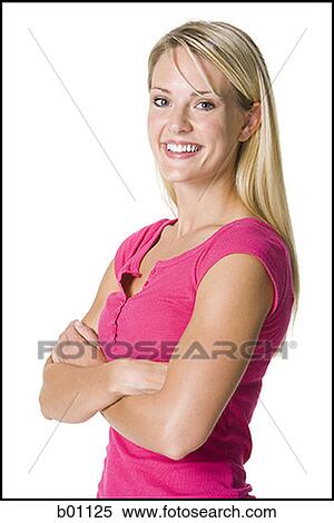 Stock Photography - Portrait of a young woman with her arms crossed. Fotosearch