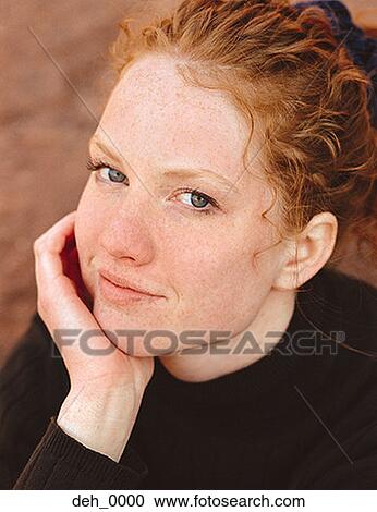 Portrait of a young woman with her hand on her chin View Large Photo Image Stock Image - Portrait of a young woman with her hand on her chin. Fotosearch