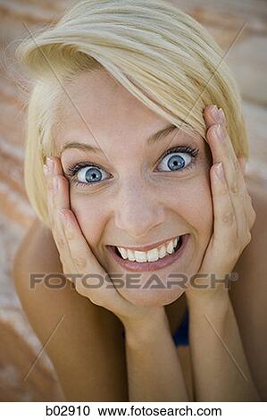 Portrait of a young woman with her mouth open View Large Photo Image Stock Image - Portrait of a young woman with her mouth open. Fotosearch